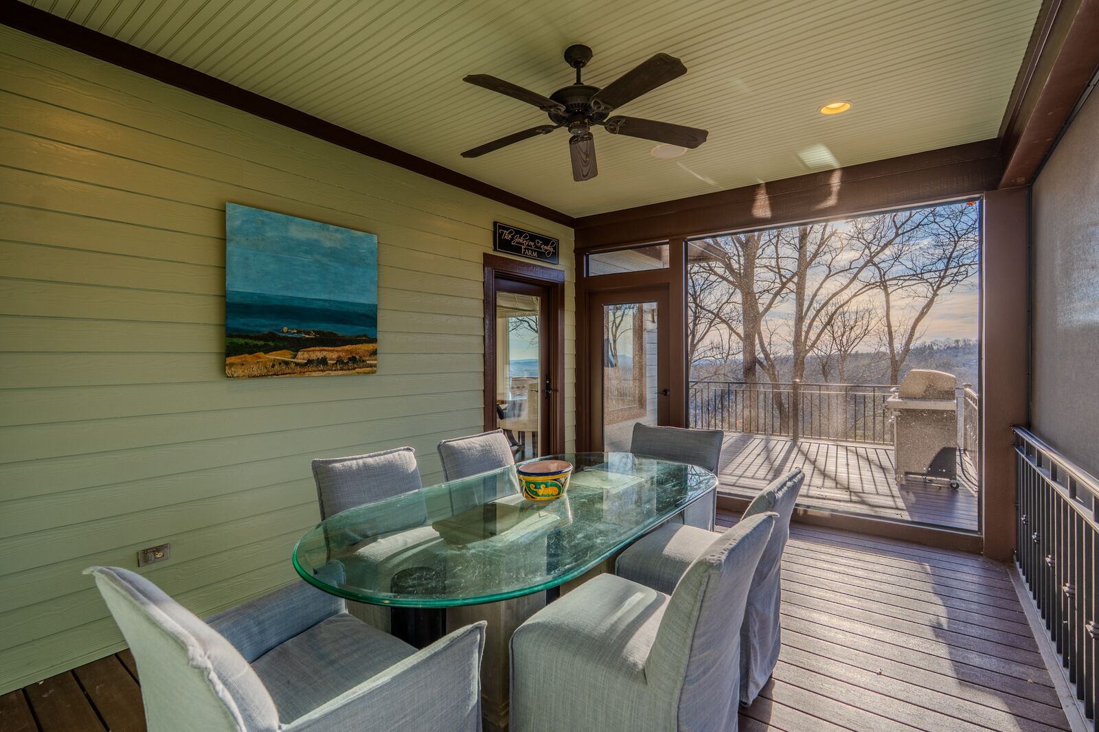 Screened porch dining at 202 Eagle Rock Road